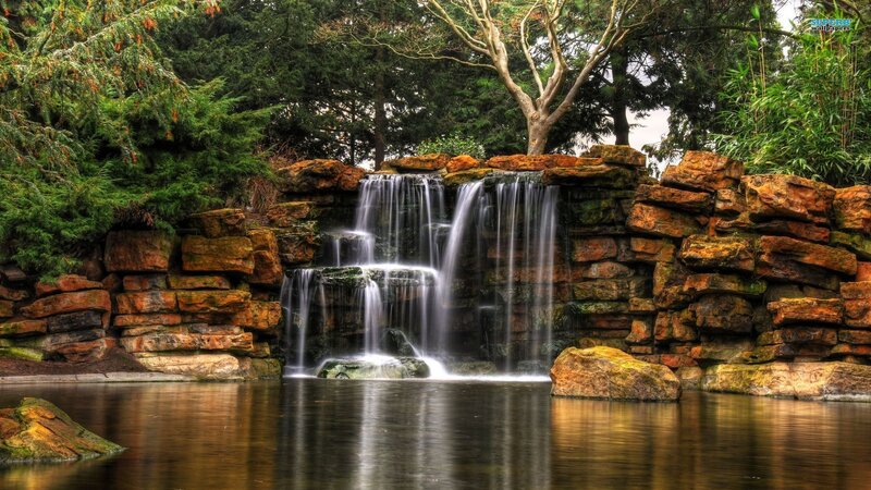 Artificial Waterfall in Garden — Green, Serene, Afternoon, Photograph, Rocks, Trees