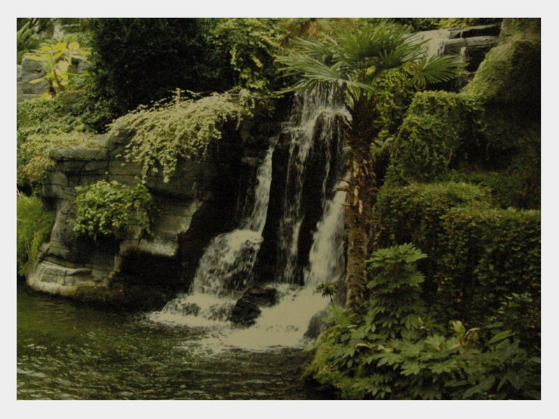 Artificial Waterfall in Garden — Green, Serene, Photograph