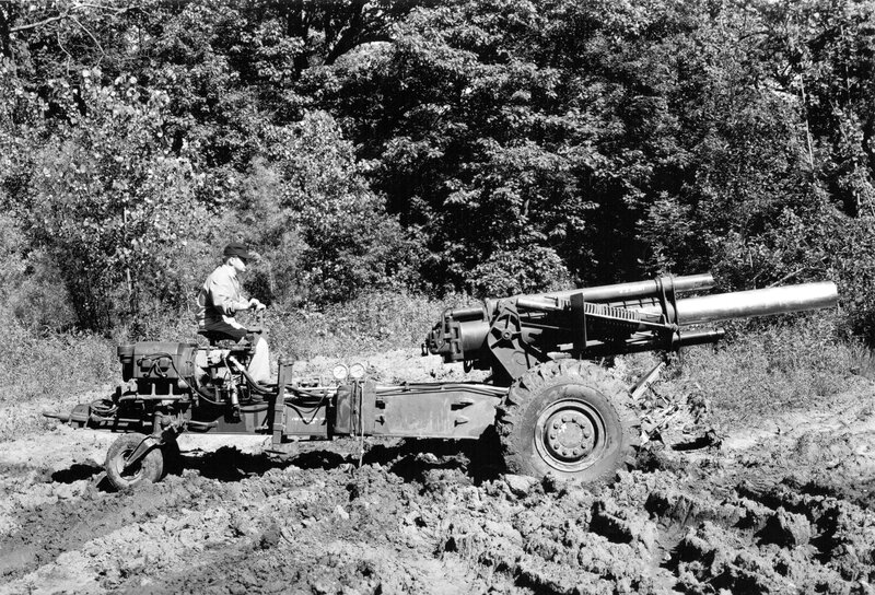 Artillery being towed through mud