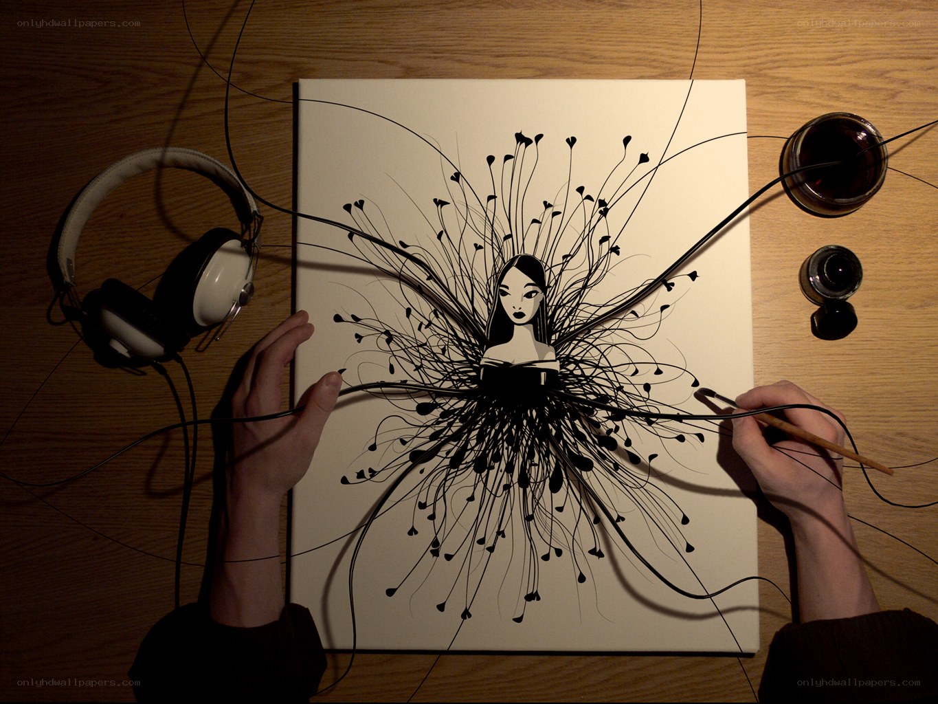 Artist creating ink illustration