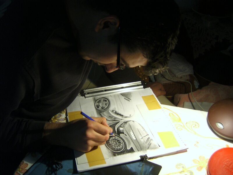 Artist drawing a car sketch