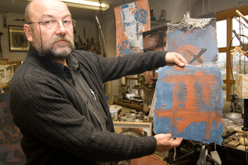 Artist Holding Artwork