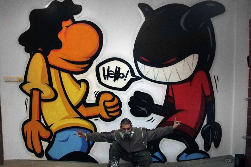 Artist in Front of Mural — Black