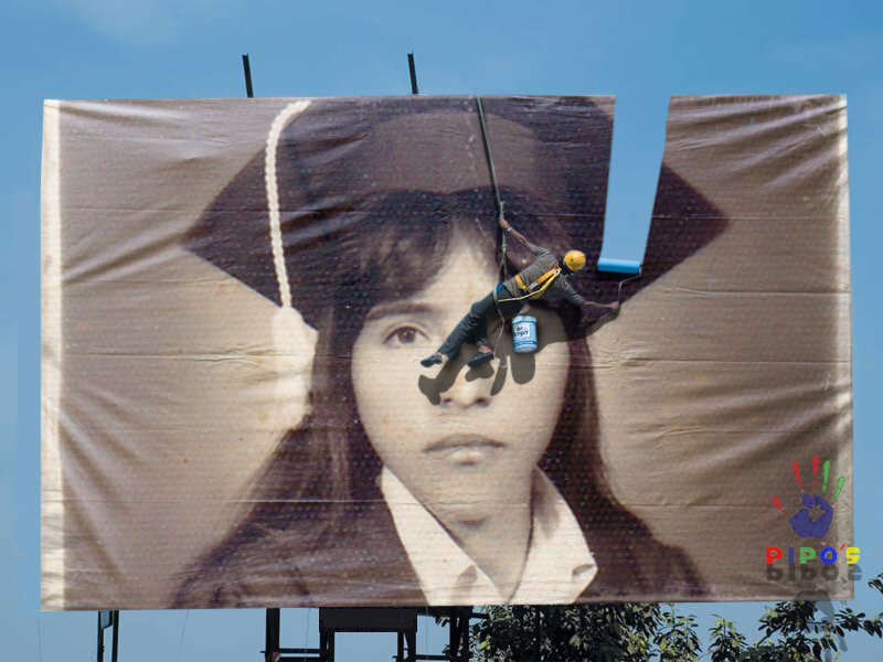 Artist painting a graduation portrait