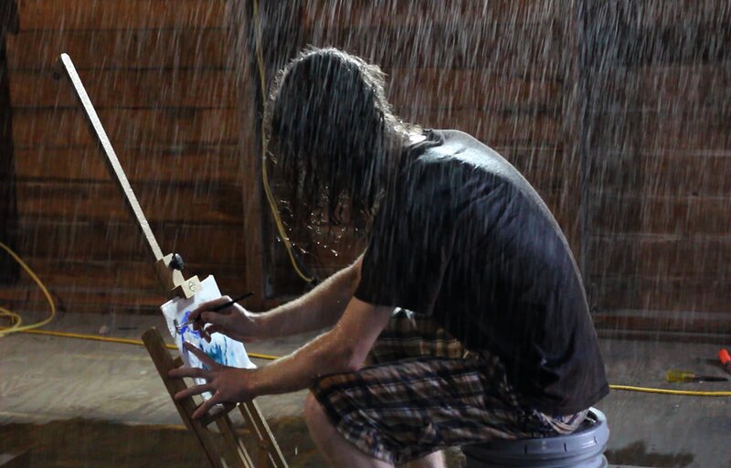 Artist Painting in Rain