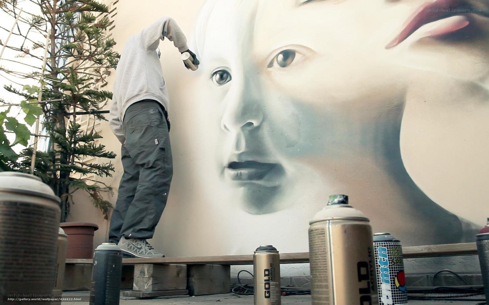 Artist painting mural on wall