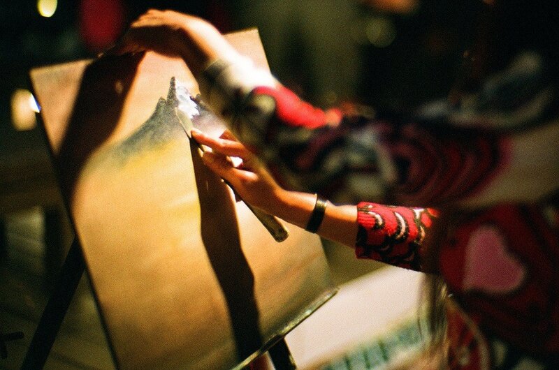 Artist painting on canvas