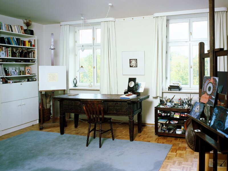 artist's studio with desk and art supplies
