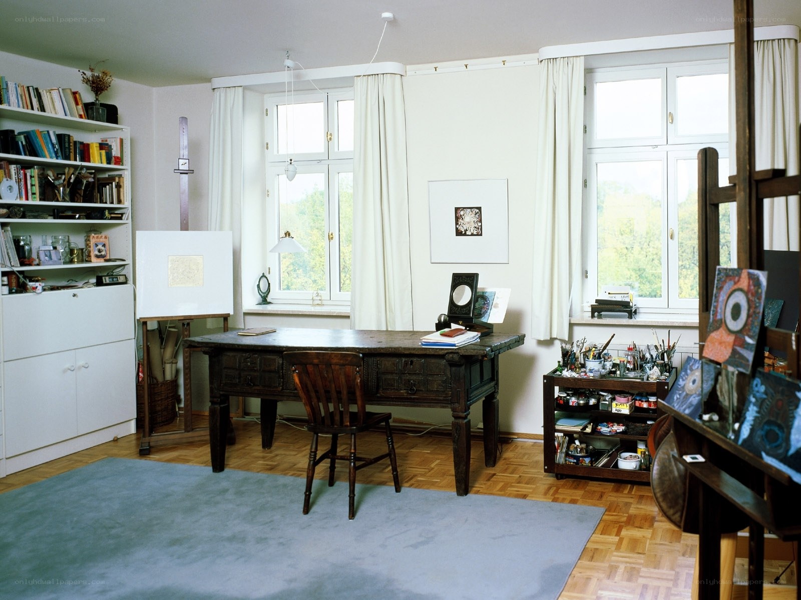 artist's studio with desk and art supplies