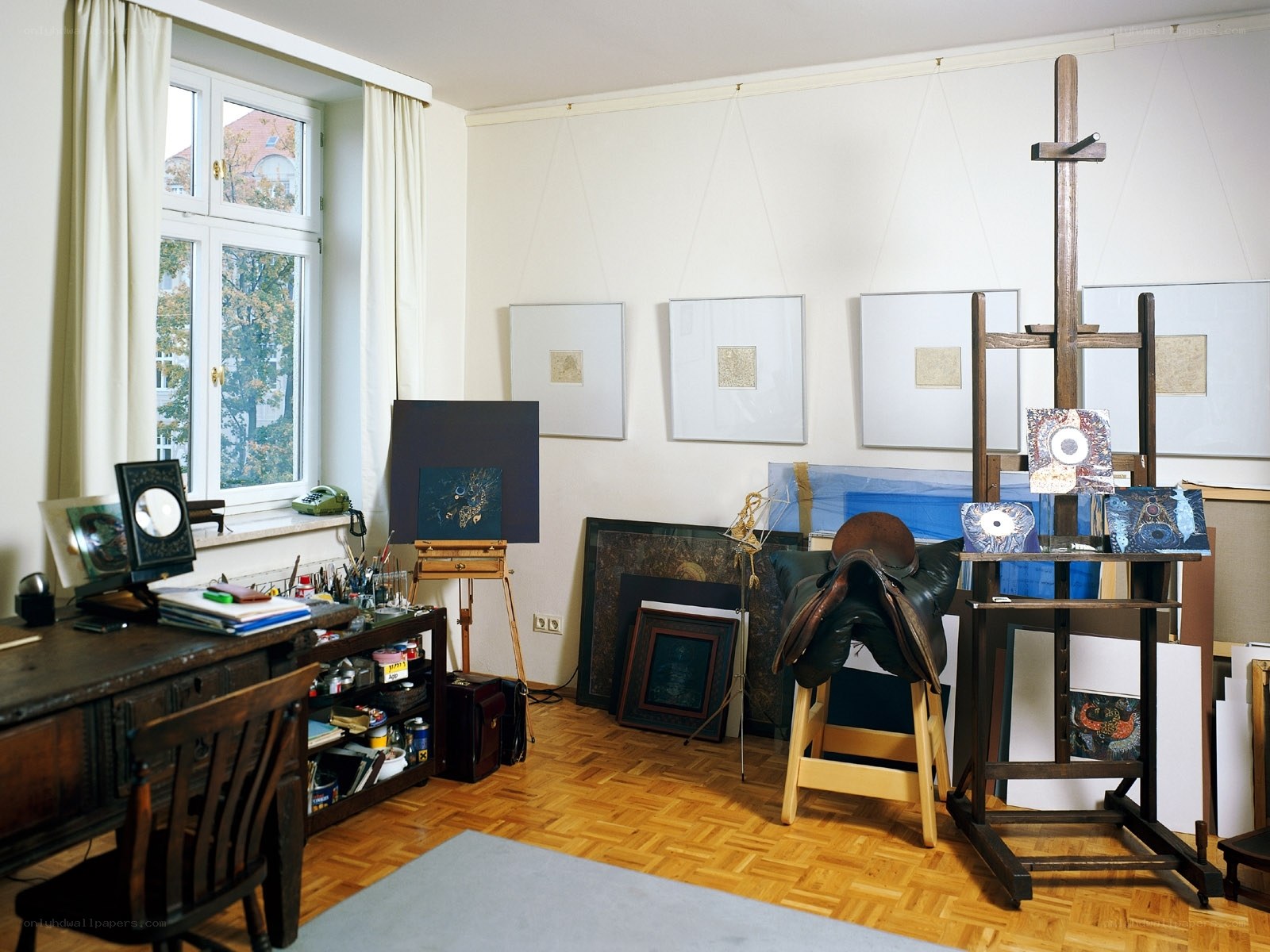 artist's studio with easels and art supplies