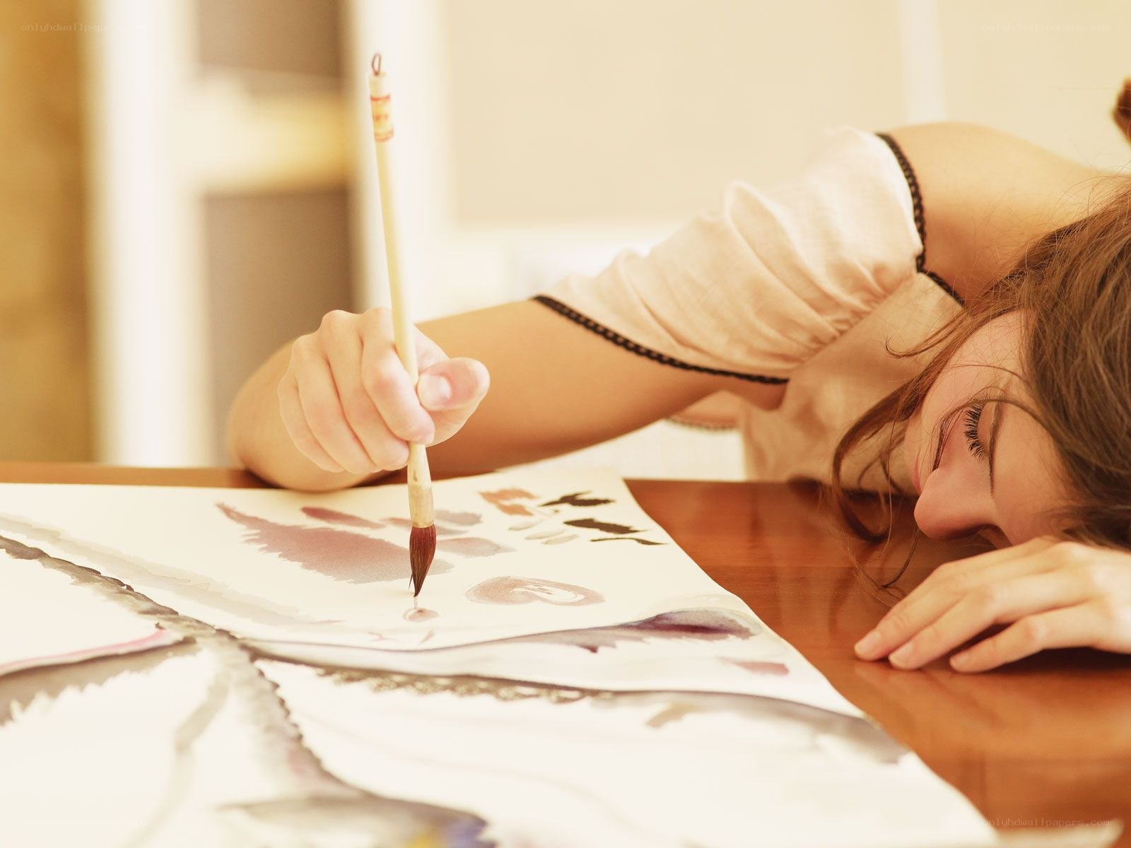 Artist sleeping while painting