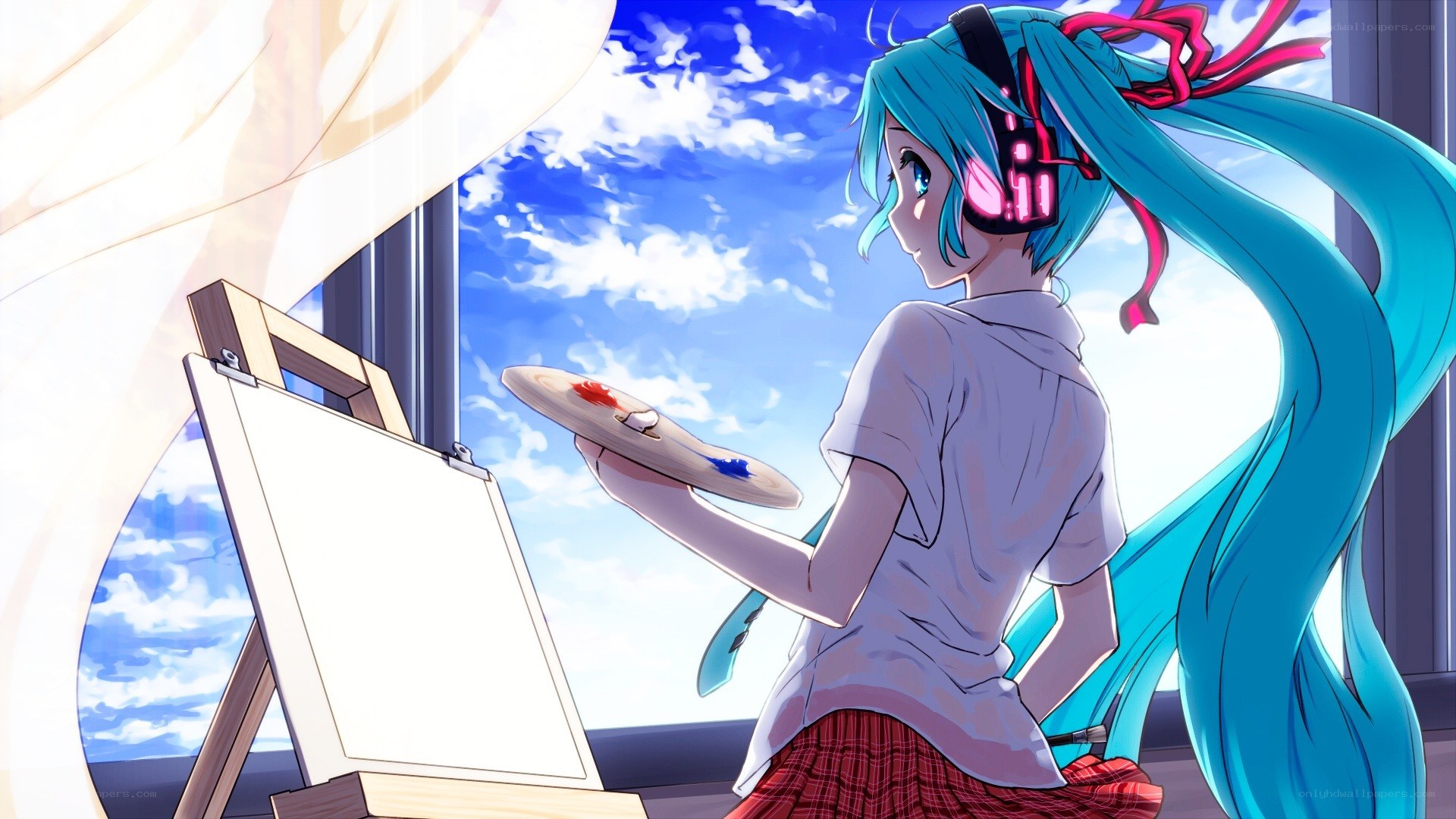 artist with blue hair painting
