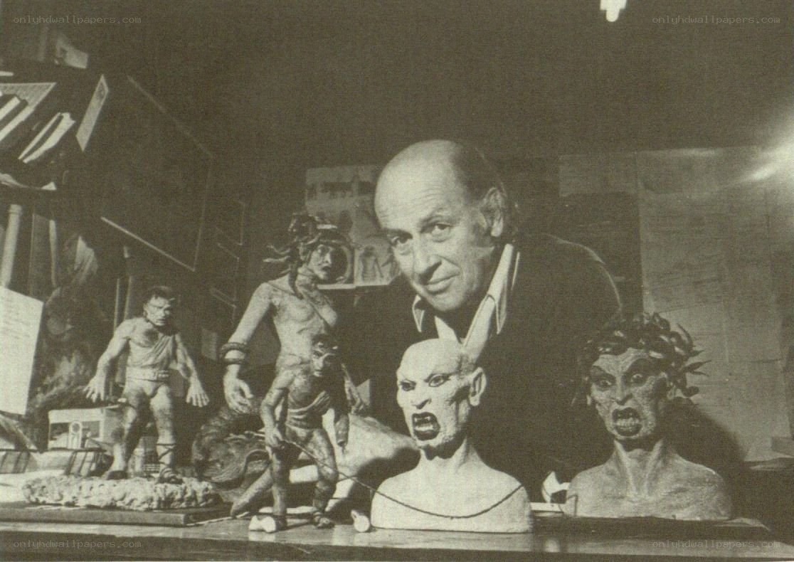 artist with monster sculptures
