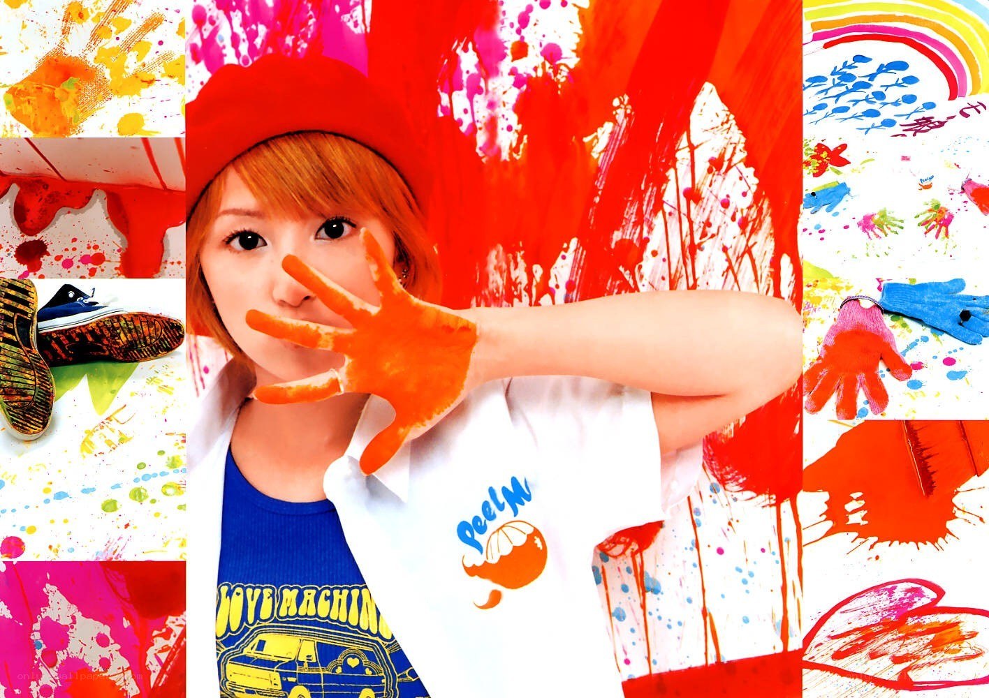 artist with paint-covered hand