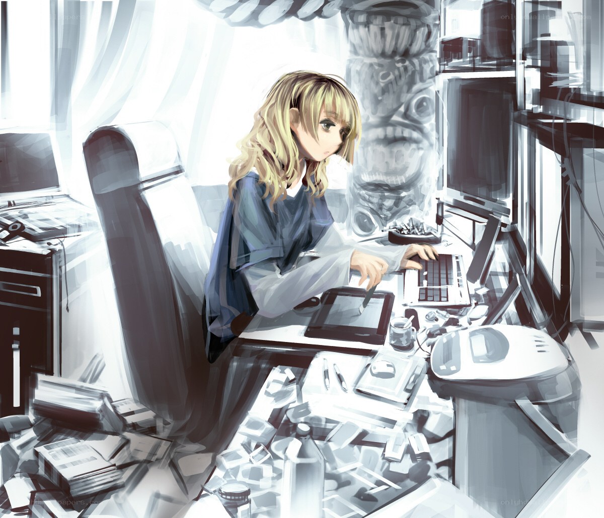 artist working at a cluttered desk
