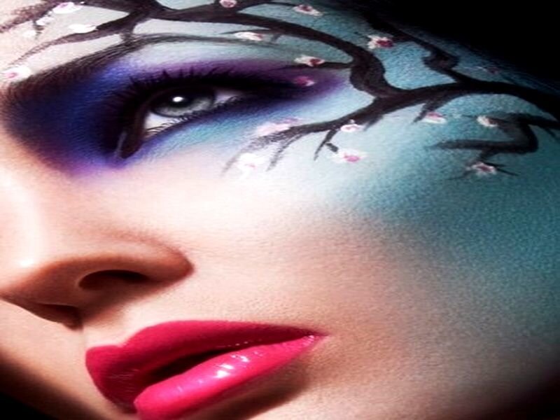 artistic face paint with cherry blossoms