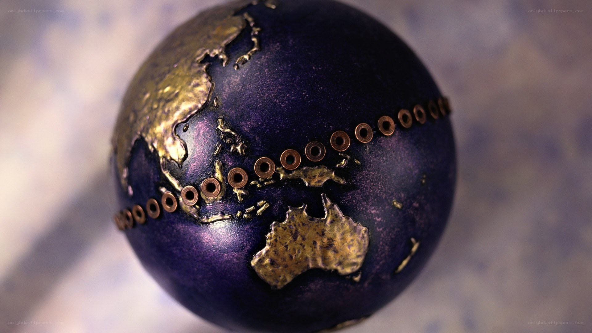 artistic globe with golden continents