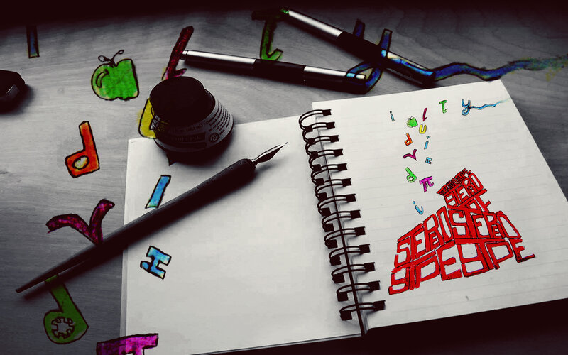artistic notebook with calligraphy tools