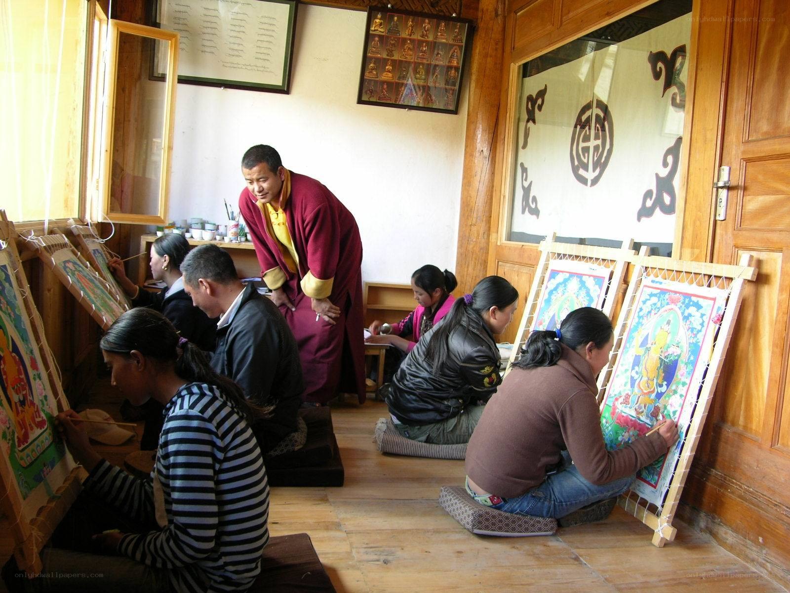 Artists creating thangka paintings