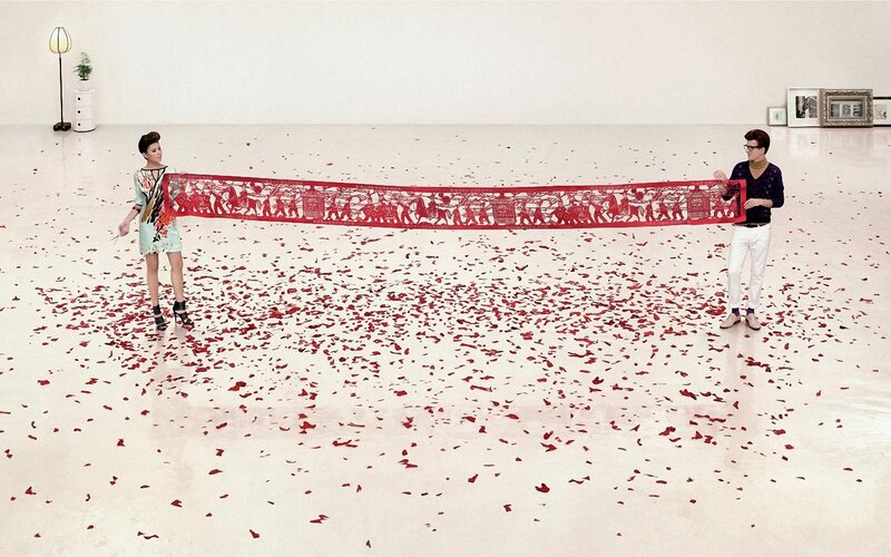 Artists with red paper cutout