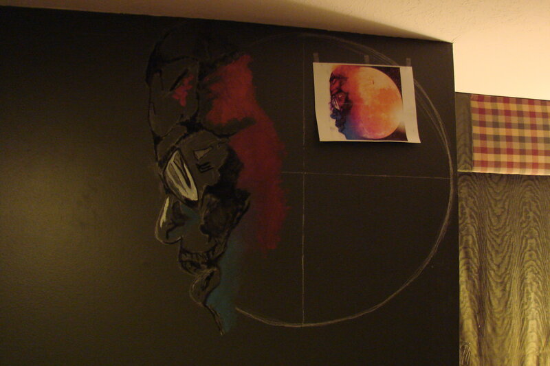artwork on a dark wall