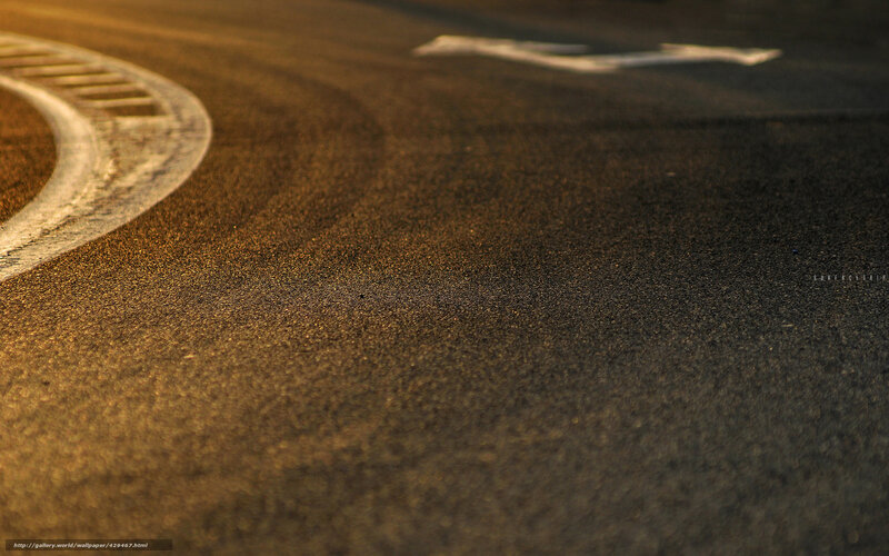 asphalt road at sunset