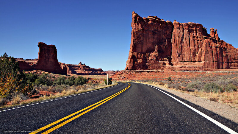 Asphalt Road in Desert — Blue, Serene, Afternoon, Photograph, Rock Formations