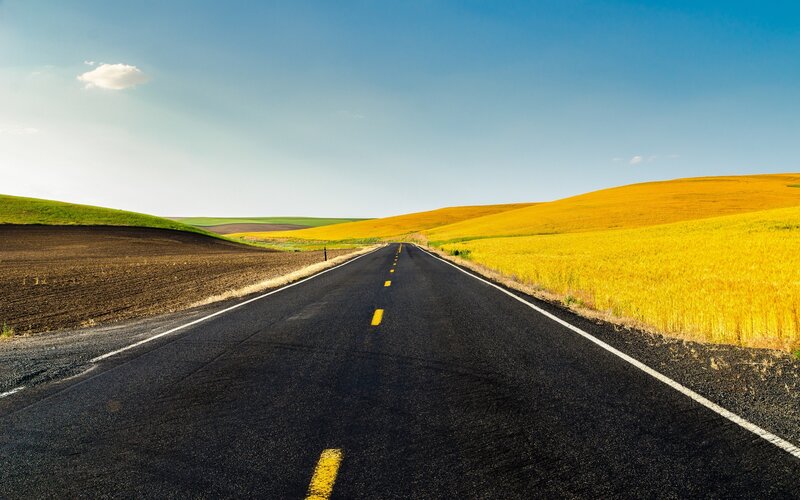 Asphalt Road Through Fields — Blue