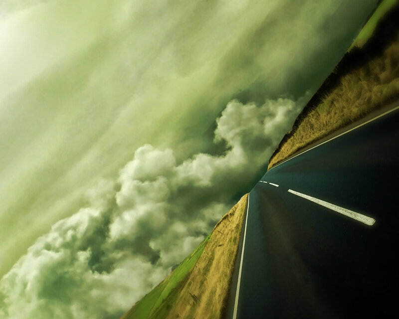 Asphalt Road under Stormy Sky