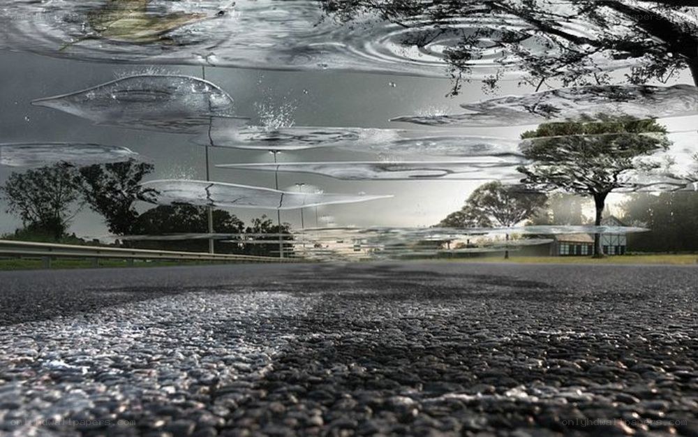 asphalt road with water reflections