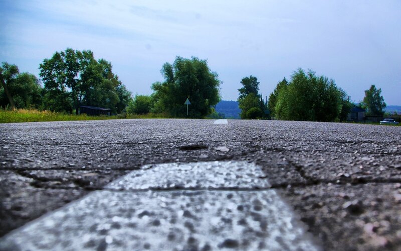 asphalt road with white lines