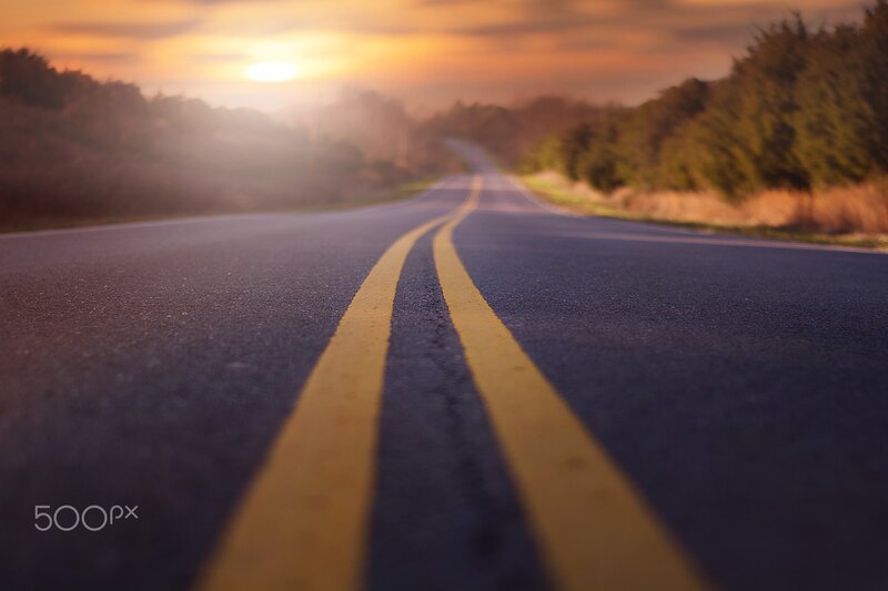Asphalt Road with Yellow Lines — Serene, Sunset