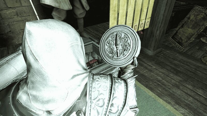 Assassin's Creed character holding emblem