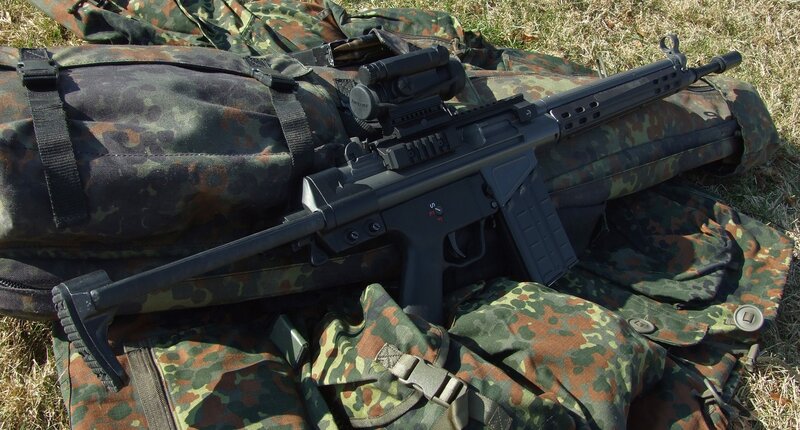 Assault rifle on camouflage gear