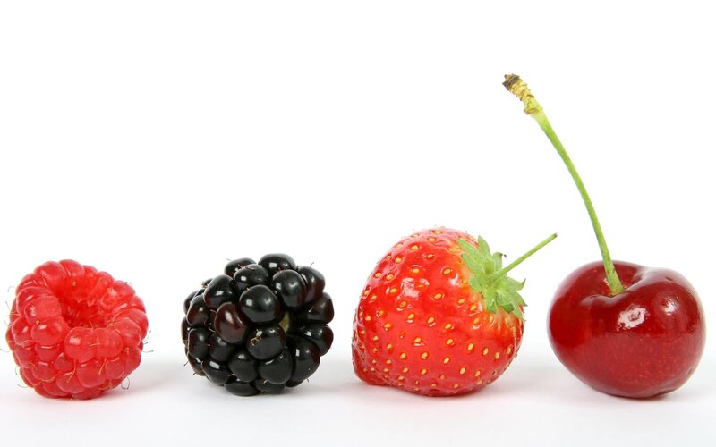 assorted berries in a row