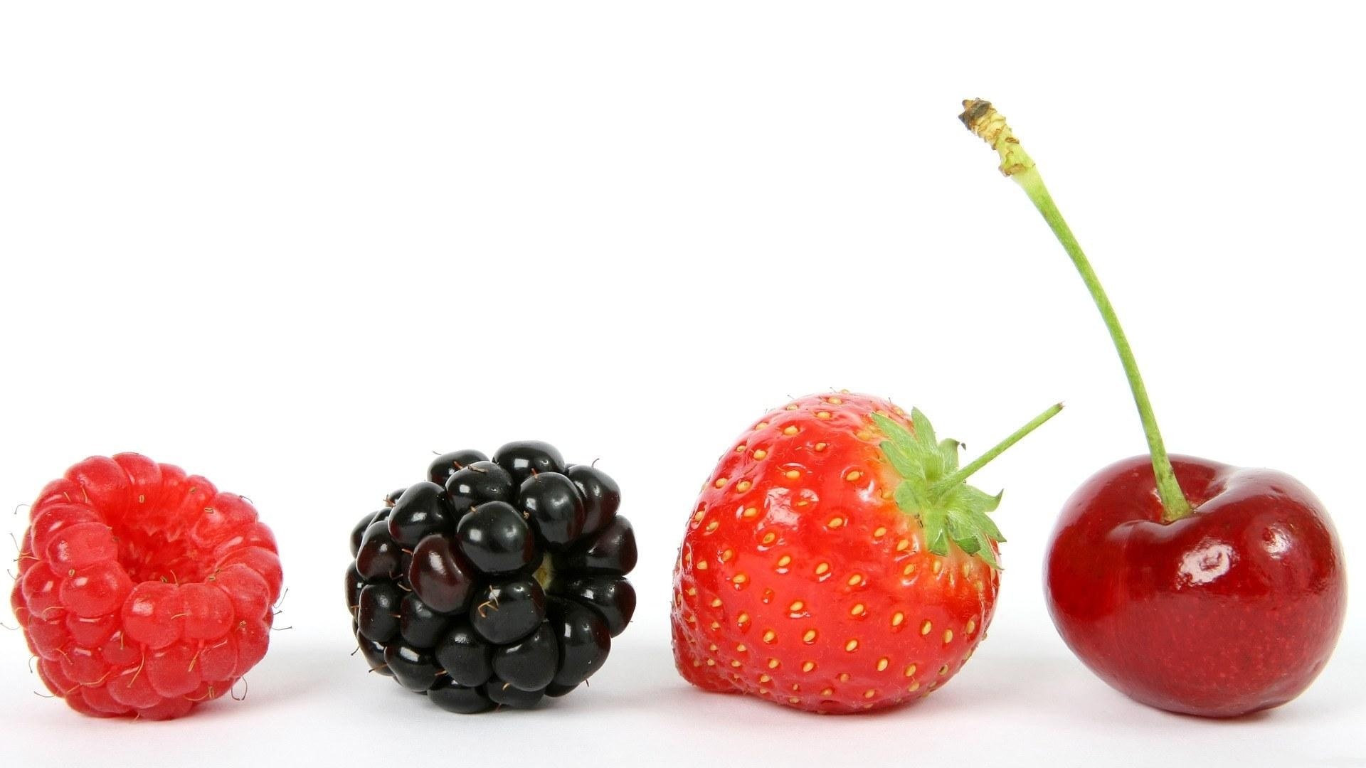 assorted berries in a row