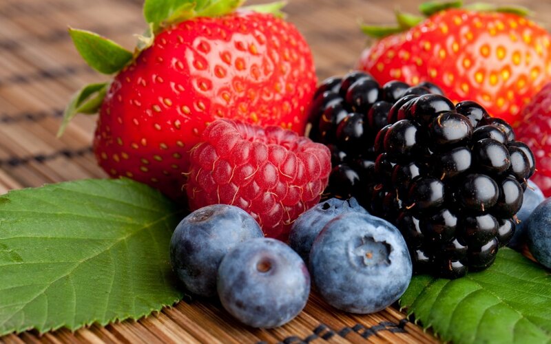 Assorted Berries on Leaves — Red