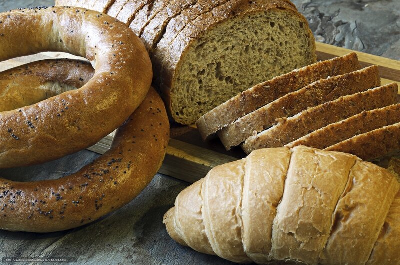 Assorted breads on a cutting board