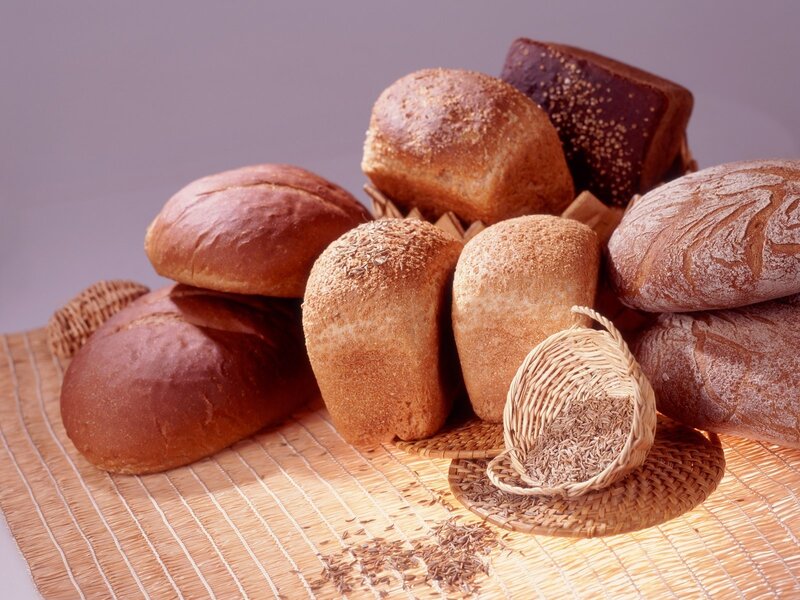 Assorted breads on a mat