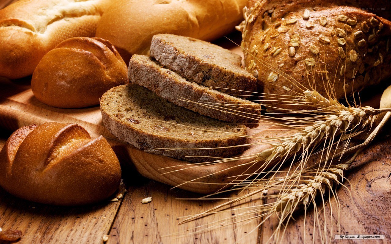 Assorted breads on wooden board
