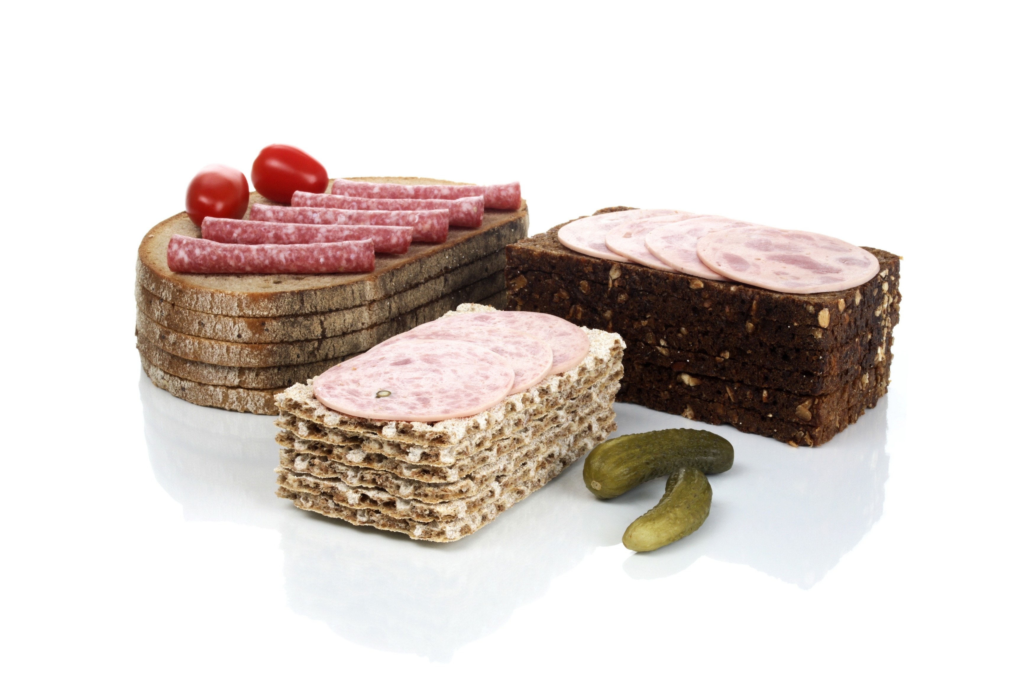 Assorted breads with meats and pickles