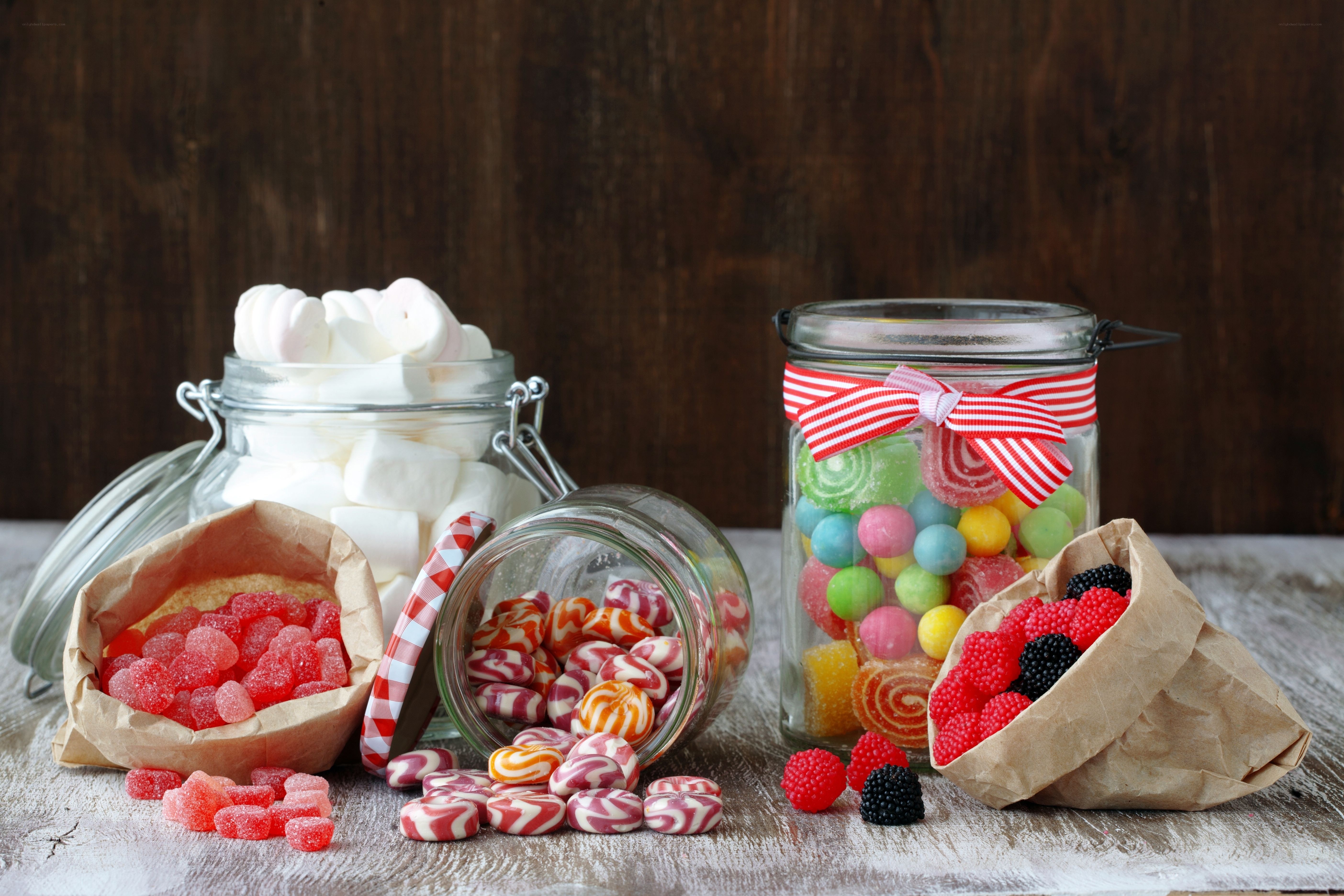Assorted candies in jars and bags