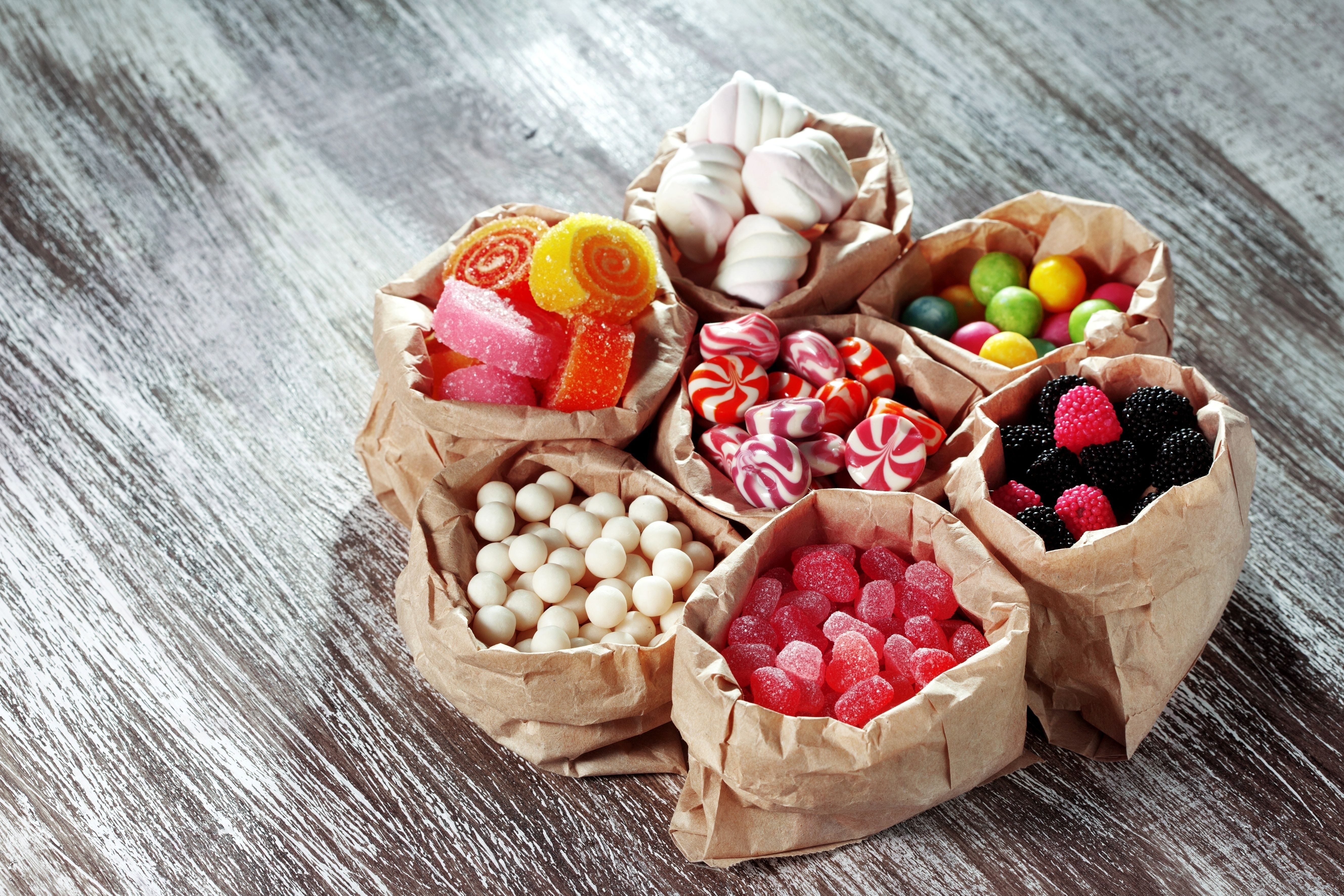 assorted candies in paper bags