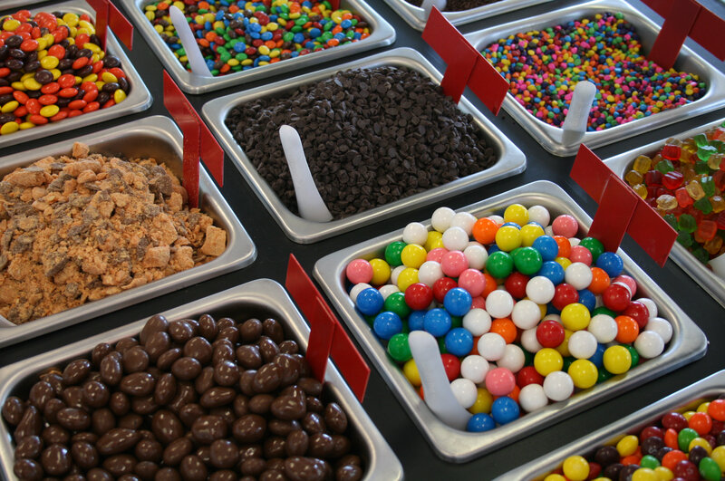 assorted candy toppings display