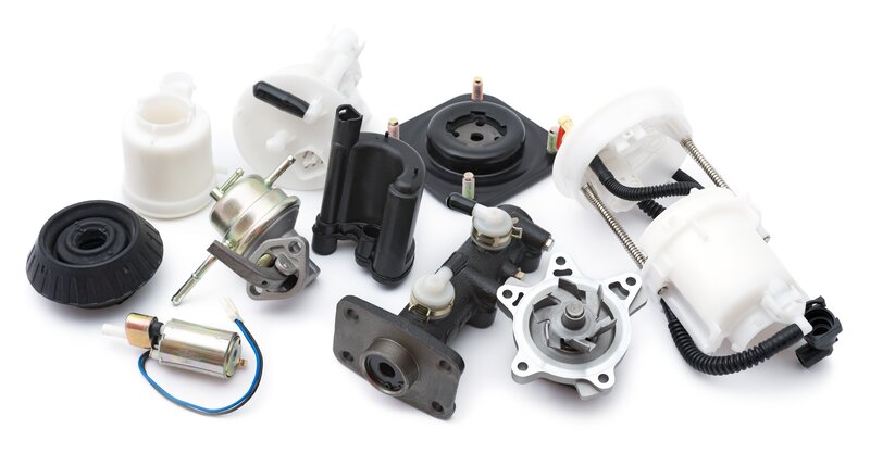 assorted car parts on white