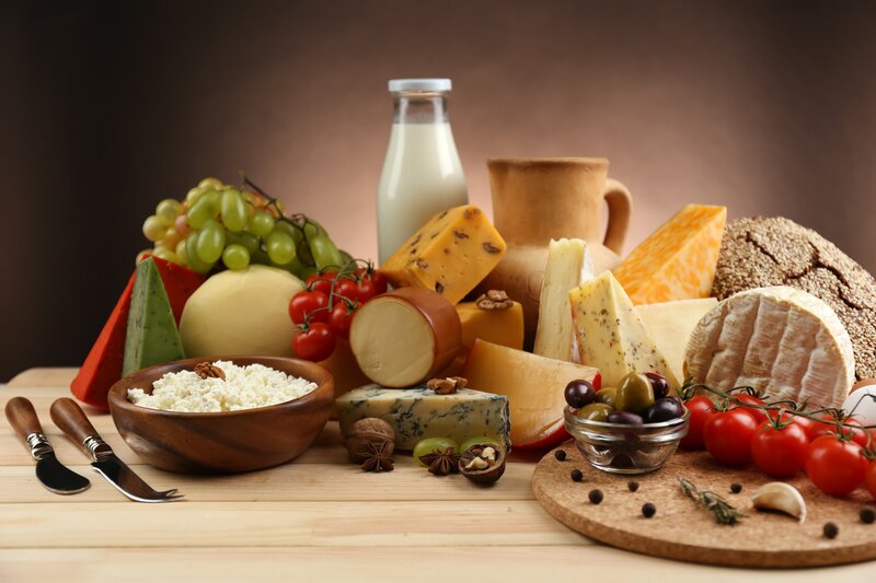 Assorted Cheeses and Fruits — Brown