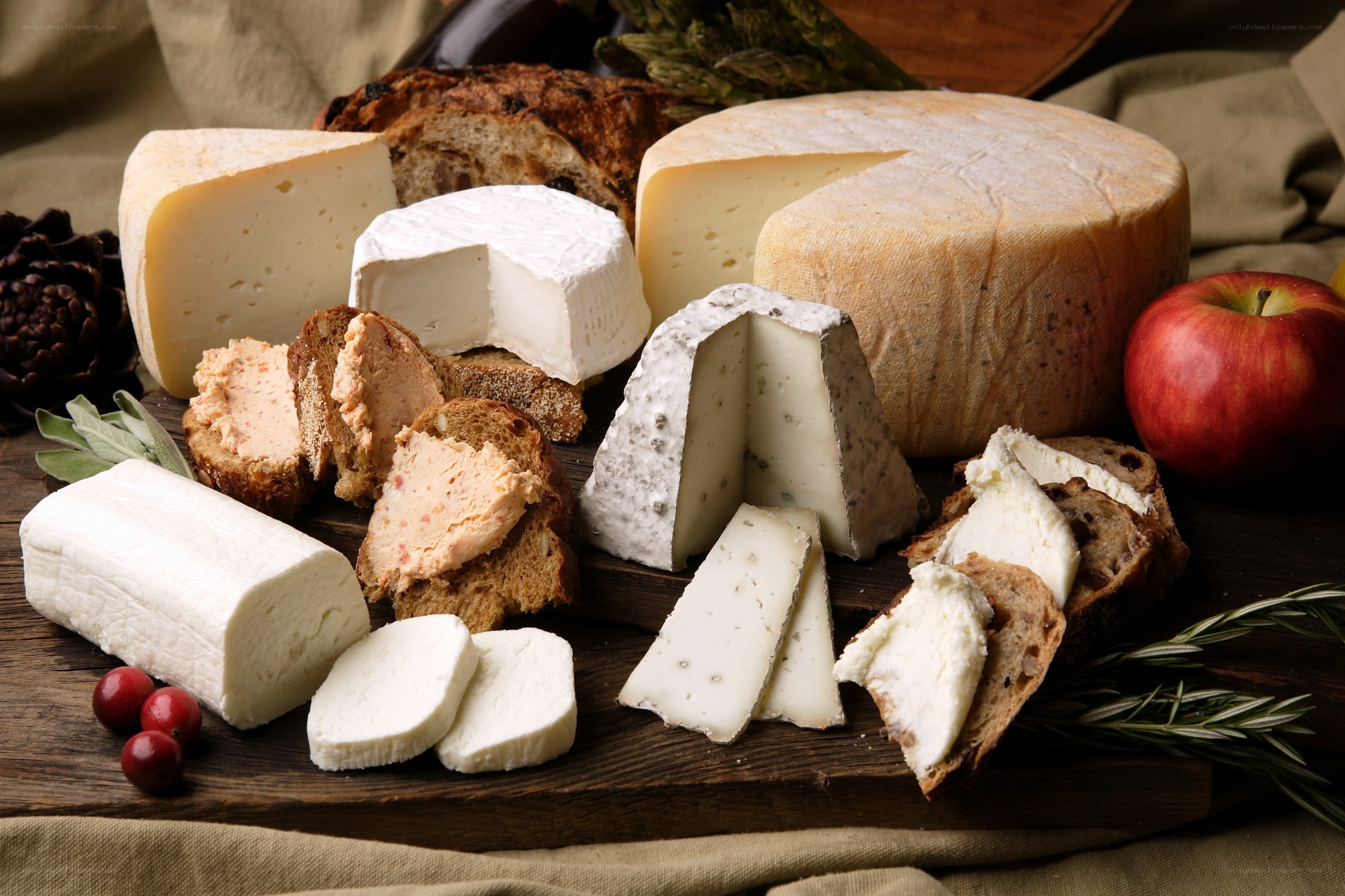 Assorted cheeses on a wooden board