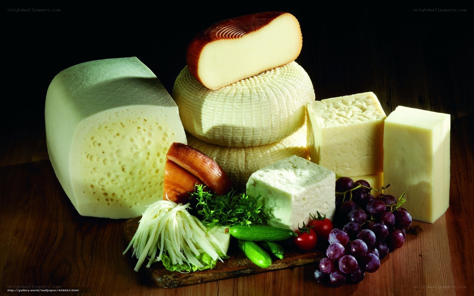 Assorted cheeses with fruits and vegetables