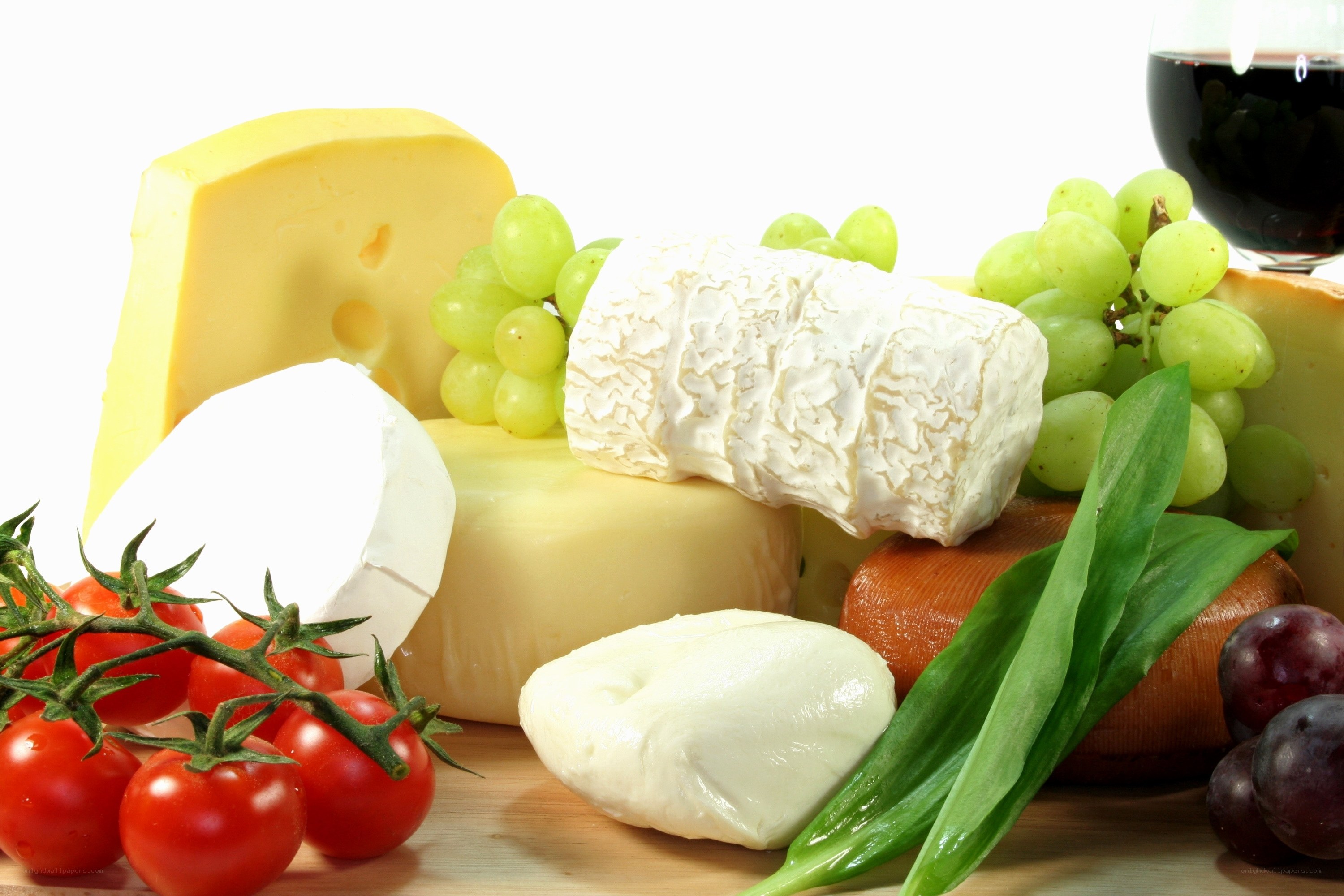 Assorted cheeses with fruits and wine