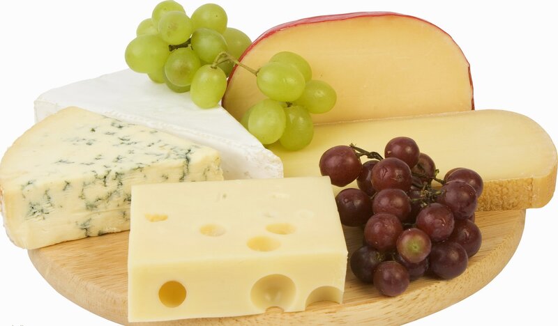 assorted cheeses with grapes